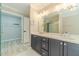 Bathroom with walk-in shower, closet access and double vanity at 4120 Grady Smith Rd, Loganville, GA 30052
