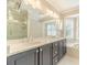 Bathroom with double vanity, granite countertop, and bay window at 4120 Grady Smith Rd, Loganville, GA 30052