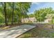 Home's exterior with a long driveway leading up to the home and a small outbuilding at 4120 Grady Smith Rd, Loganville, GA 30052