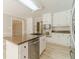 Open concept kitchen featuring granite countertops, white cabinets, and stainless steel appliances at 4120 Grady Smith Rd, Loganville, GA 30052