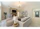 Open living space with a stone fireplace, neutral tones, and ample natural light at 4120 Grady Smith Rd, Loganville, GA 30052
