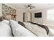 Comfortable main bedroom featuring stone fireplace, ceiling fan, and a spacious layout at 4120 Grady Smith Rd, Loganville, GA 30052