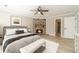 Cozy main bedroom with stone fireplace, ceiling fan, and decor for a relaxing ambiance at 4120 Grady Smith Rd, Loganville, GA 30052