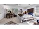 Cozy bedroom with large windows, a ceiling fan, and a comfortable bed at 4385 Pinehollow Court Ct, Alpharetta, GA 30022