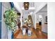 Bright and airy foyer with hardwood floors, high ceilings, and a staircase leading to the upper level at 4385 Pinehollow Court Ct, Alpharetta, GA 30022