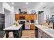 Spacious kitchen featuring an island with marble countertop and stainless-steel appliances at 4385 Pinehollow Court Ct, Alpharetta, GA 30022
