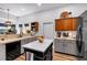 Well-lit kitchen featuring a marble island, updated appliances, and plenty of countertop space at 4385 Pinehollow Court Ct, Alpharetta, GA 30022