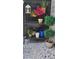 Stylish outdoor decor with potted plants and decorative shelving on a peaceful patio at 4385 Pinehollow Court Ct, Alpharetta, GA 30022