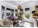 Sunlit room with views of the backyard, a comfortable sitting area, and decorative accents at 4385 Pinehollow Court Ct, Alpharetta, GA 30022