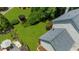 A spacious backyard featuring lush green grass and mature landscaping at 1410 Kingfield Dr, Johns Creek, GA 30005