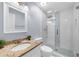 Beautiful bathroom featuring granite countertop and glass shower with decorative tiling at 1410 Kingfield Dr, Johns Creek, GA 30005