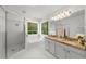 Bathroom featuring a shower, soaking tub, double sinks, and granite countertops at 1410 Kingfield Dr, Johns Creek, GA 30005