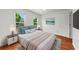 Bedroom with luxury vinyl plank flooring, two large windows, and ample space at 1410 Kingfield Dr, Johns Creek, GA 30005