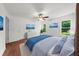 Bedroom featuring a fan, hardwood floors, and natural light at 1410 Kingfield Dr, Johns Creek, GA 30005