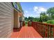 Decking area with wooden railing overlooking the lush lawn at 1410 Kingfield Dr, Johns Creek, GA 30005