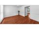 Bright dining room with hardwood floors and decorative molding, adjacent to an open doorway at 1410 Kingfield Dr, Johns Creek, GA 30005