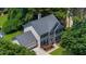 Charming two-story home featuring a well-manicured lawn, attached garage, and inviting front entrance at 1410 Kingfield Dr, Johns Creek, GA 30005
