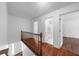 Hallway with hardwood floors and white walls at 1410 Kingfield Dr, Johns Creek, GA 30005