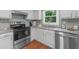 Kitchen with stainless steel appliances and ample countertop space at 1410 Kingfield Dr, Johns Creek, GA 30005