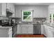Bright kitchen with stainless steel appliances and plenty of counter space at 1410 Kingfield Dr, Johns Creek, GA 30005