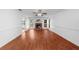 Spacious living room featuring a fireplace, hardwood flooring, and bright natural light at 1410 Kingfield Dr, Johns Creek, GA 30005