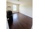 This bedroom features a hardwood floor, bright window, and neutral paint at 7104 Georges Way, Morrow, GA 30260