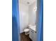 This powder room features a white vanity, wood-look floor, and modern lighting at 1731 Pryor Sw Rd # 307, Atlanta, GA 30315