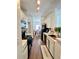 Bright, functional kitchen featuring white cabinets, black appliances, and a view to the dining area at 1731 Pryor Sw Rd # 307, Atlanta, GA 30315