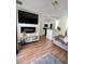 Cozy living room featuring hardwood flooring, a modern fireplace, and a view of the kitchen at 1731 Pryor Sw Rd # 307, Atlanta, GA 30315