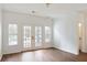 Spacious living room featuring hardwood flooring and light-filled French doors at 1731 Pryor Sw Rd # 307, Atlanta, GA 30315