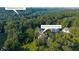 Aerial view shows the home's location near Chattahoochee River and lush greenery at 4140 Riverlook Parkway Se Se Pkwy # 209, Marietta, GA 30067
