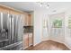 Eat-in kitchen featuring stainless steel refrigerator, granite counters, hardwood floors and plenty of light at 4140 Riverlook Parkway Se Se Pkwy # 209, Marietta, GA 30067