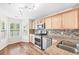Bright kitchen boasts stainless steel appliances, granite countertops, hardwood floors and ample natural light at 4140 Riverlook Parkway Se Se Pkwy # 209, Marietta, GA 30067