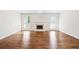 Spacious living room featuring hardwood floors, fireplace, neutral walls, and large windows with lots of natural light at 4140 Riverlook Parkway Se Se Pkwy # 209, Marietta, GA 30067