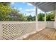 Covered patio offers a view of lush green trees and a lattice railing at 4140 Riverlook Parkway Se Se Pkwy # 209, Marietta, GA 30067