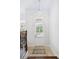 Inviting foyer with tile flooring, glass paned door, and stairway at 5139 Peachtree Road, Chamblee, GA 30341