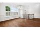 Spacious living room with gleaming hardwood floors, crown molding, and plantation shutters at 5139 Peachtree Road, Chamblee, GA 30341