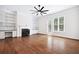 Spacious living room with custom built-ins, fireplace, and lots of natural light at 5139 Peachtree Road, Chamblee, GA 30341