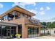 Exterior of the Harvey restaurant featuring a modern design with a balcony and large windows at 5139 Peachtree Road, Chamblee, GA 30341