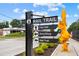 A Rail Trail sign with directions to City Hall, Dine/Shop, and the Rail Trail at 5139 Peachtree Road, Chamblee, GA 30341