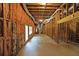 Unfinished basement with exposed framework, concrete floor, and doorway leading outside at 5176 Shotwell St, Woodstock, GA 30188