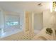 Bright bathroom featuring a separate bathtub and shower at 5176 Shotwell St, Woodstock, GA 30188
