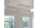 This sunlit bedroom features large windows and views of mature trees at 5176 Shotwell St, Woodstock, GA 30188