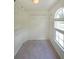 Walk-in closet with carpet and built-in shelving system at 5176 Shotwell St, Woodstock, GA 30188