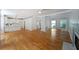 Open concept living room featuring hardwood floors, a fireplace, and open flow to the kitchen at 5176 Shotwell St, Woodstock, GA 30188