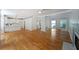 Open concept living room with hardwood floors and easy access to kitchen and staircase at 5176 Shotwell St, Woodstock, GA 30188