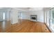 Bright living room features hardwood floors, fireplace, and large windows letting in natural light at 5176 Shotwell St, Woodstock, GA 30188
