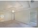 Spacious main bedroom featuring tray ceilings, carpet and walk-in closet at 5176 Shotwell St, Woodstock, GA 30188