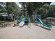 A bright and colorful playground features slides, climbing structures, and a nearby picnic table and gazebo at 5176 Shotwell St, Woodstock, GA 30188
