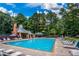 Outdoor community pool with ample lounge chairs for relaxation and enjoyment at 5176 Shotwell St, Woodstock, GA 30188